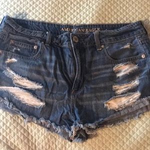 American Eagle denim shorts with rips.
